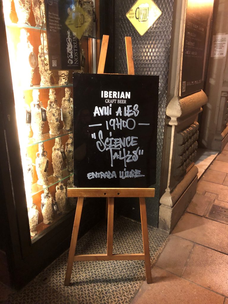 Science Talks at La Artesana sign